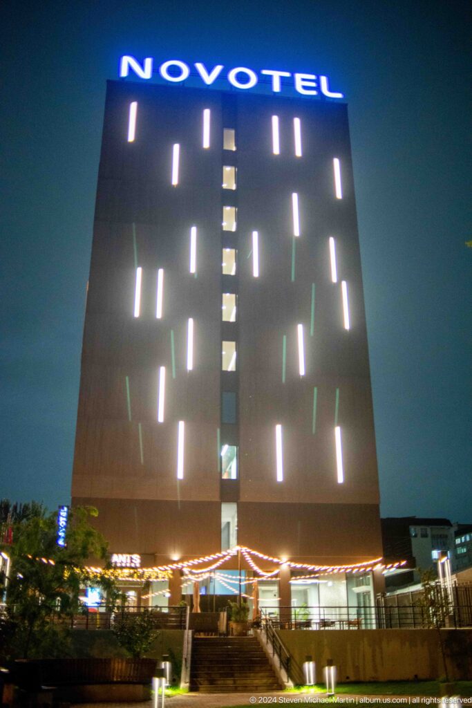 Vertical monument pierced by glowing light slits in Bishkek, Kyrgyzstan.