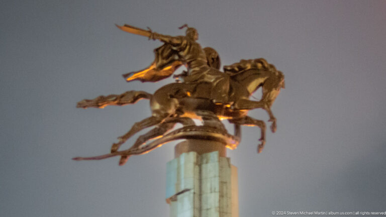 Dramatic equestrian group viewed from below in Bishkek, Kyrgyzstan.