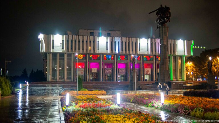 Ala-Too Square museum behind flower beds in Bishkek, Kyrgyzstan.