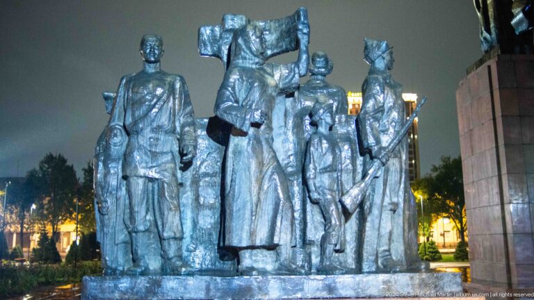 Close frontal view of multi-figure bronze memorial in Bishkek, Kyrgyzstan.