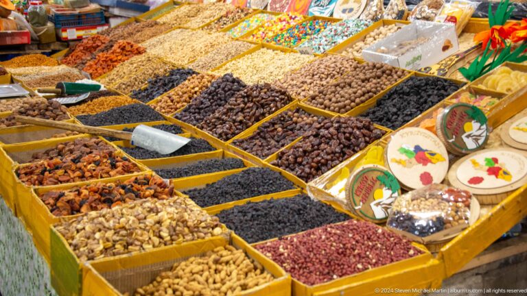 Open trays filled with nuts and dried fruit in Bishkek, Kyrgyzstan.