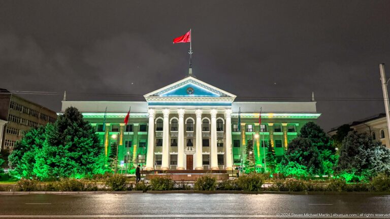 Grand white building with Kyrgyz flag in Bishkek, Kyrgyzstan.