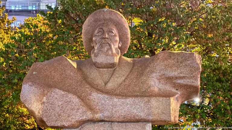 Close portrait of carved seated man in Bishkek, Kyrgyzstan.