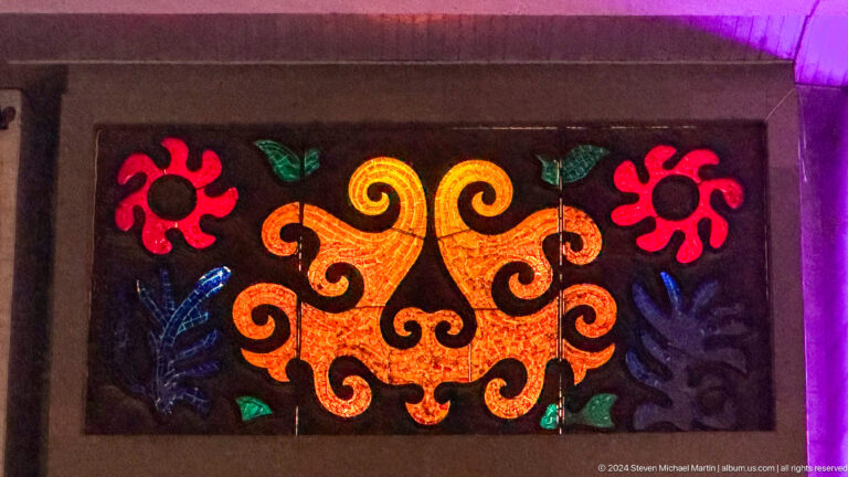 Felt panel with bold red and gold motifs in Bishkek, Kyrgyzstan.