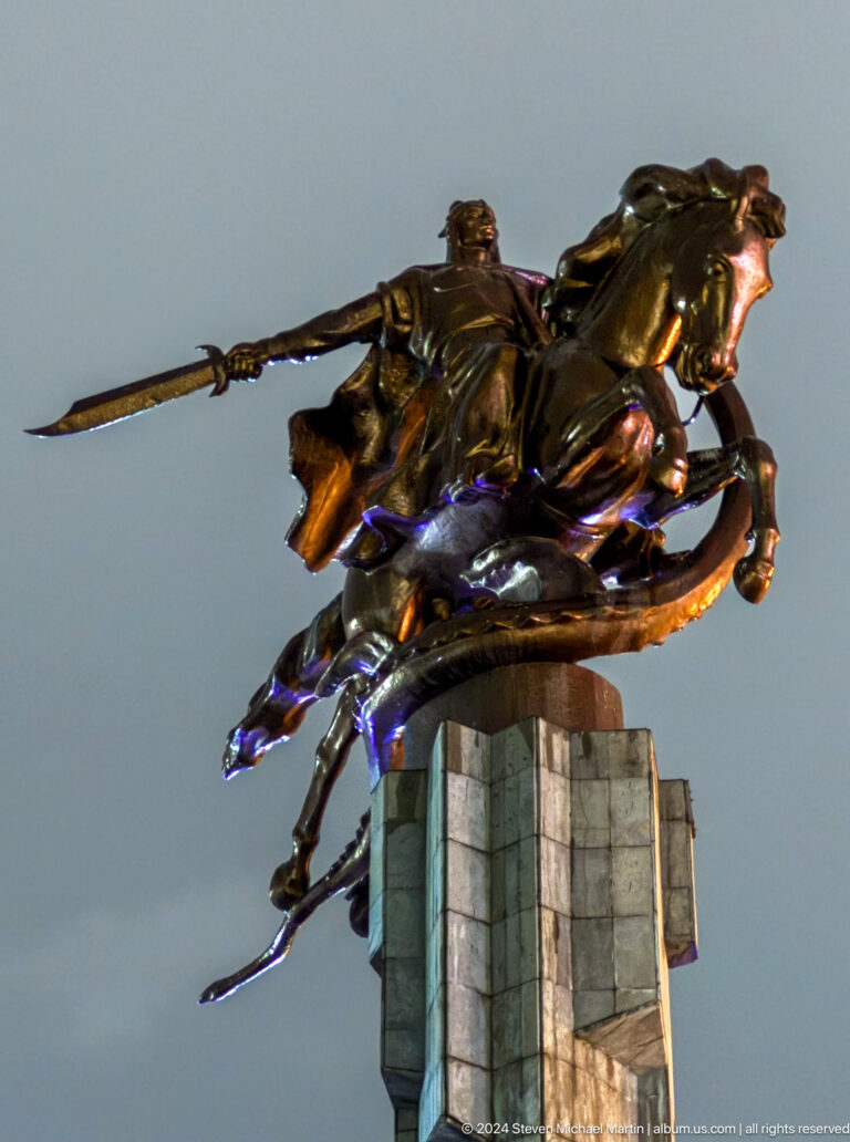 Low-angle close-up of bronze horse group in Bishkek, Kyrgyzstan.