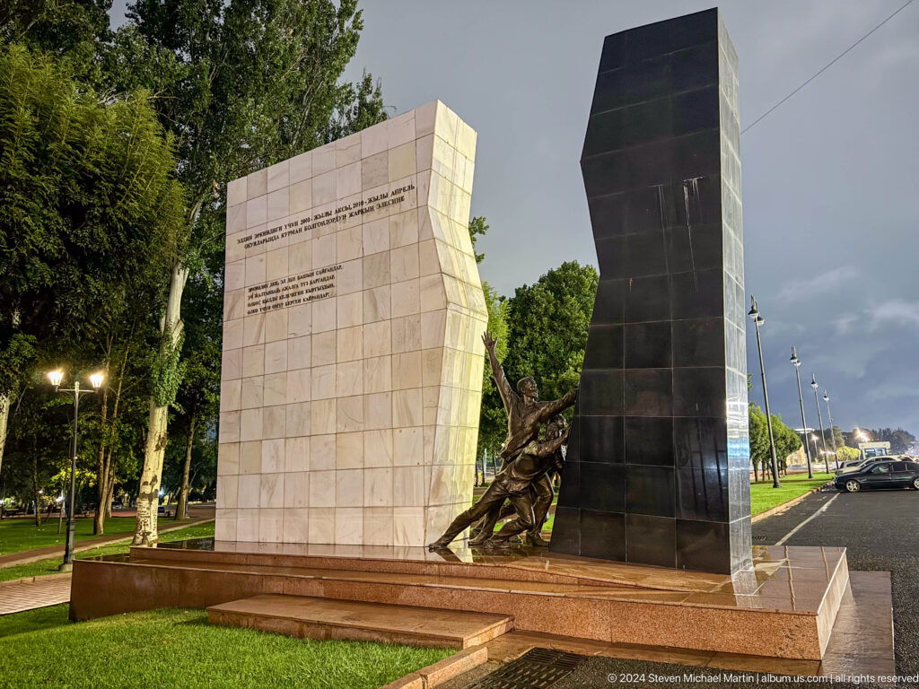 Angular memorial walls with bronze relief figures in Bishkek, Kyrgyzstan.