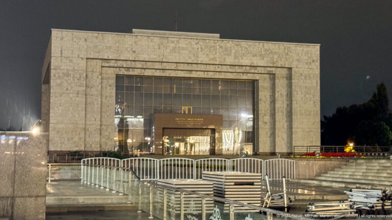 Modern marble building with broad glass entrance in Bishkek, Kyrgyzstan.