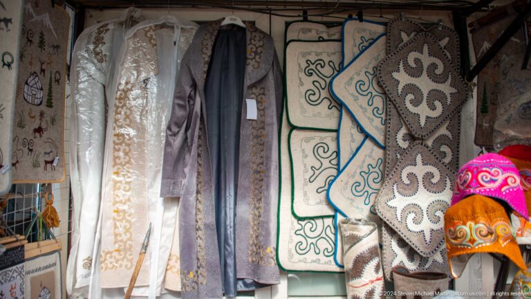 Hanging felt rugs and embroidered garments in Bishkek, Kyrgyzstan.