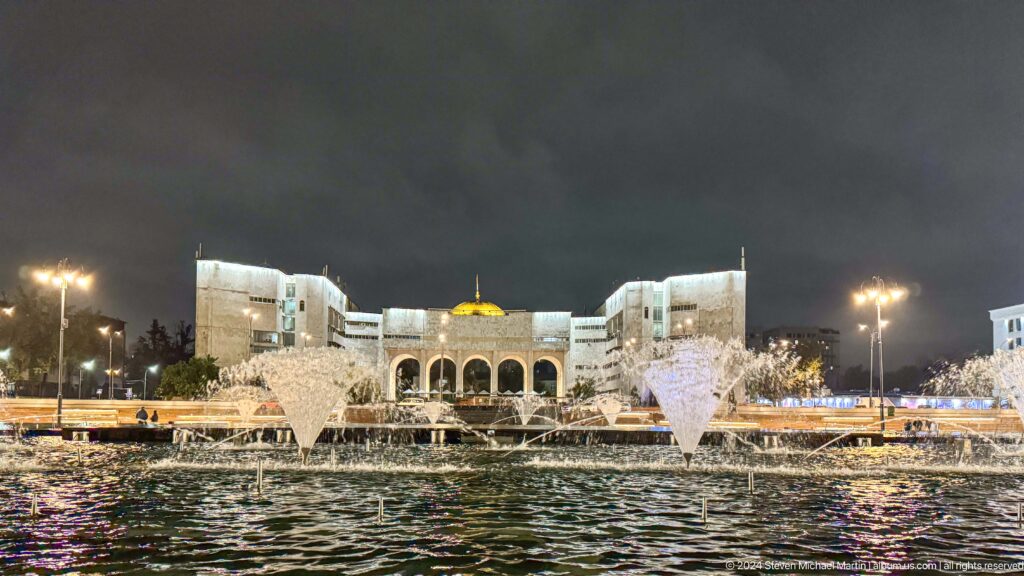 Large modern civic complex across fountains in Bishkek, Kyrgyzstan.