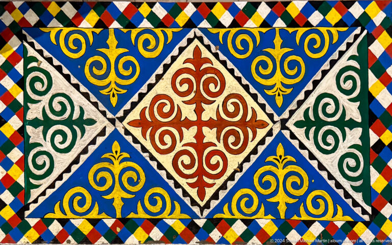 Bright geometric felt pattern in red blue and gold in Bishkek, Kyrgyzstan.