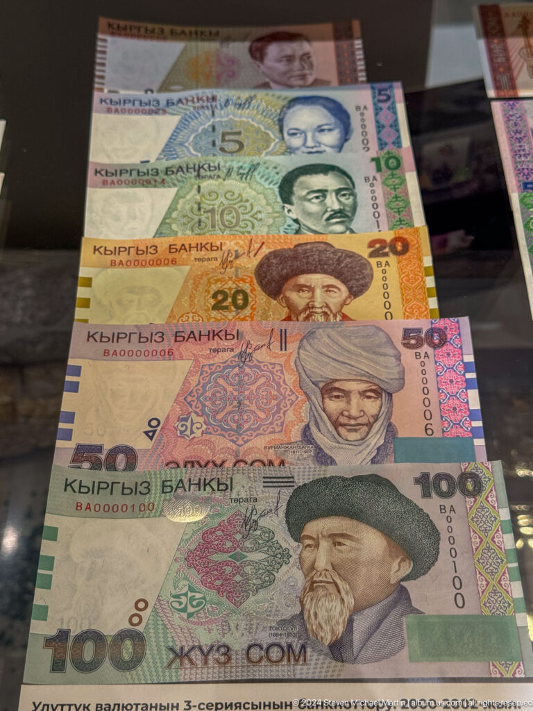 Close view of 20 50 and 100 som banknotes.