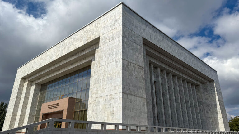 Monumental white-stone museum block viewed from a corner.