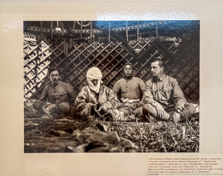 Black-and-white photograph of hunters or soldiers with game.