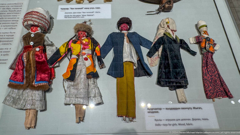 Row of dolls wearing regional costumes.