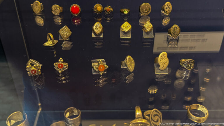 Display of Soviet badges pins and small medals.
