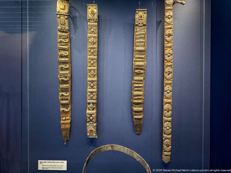 Three long embroidered bands hanging vertically.