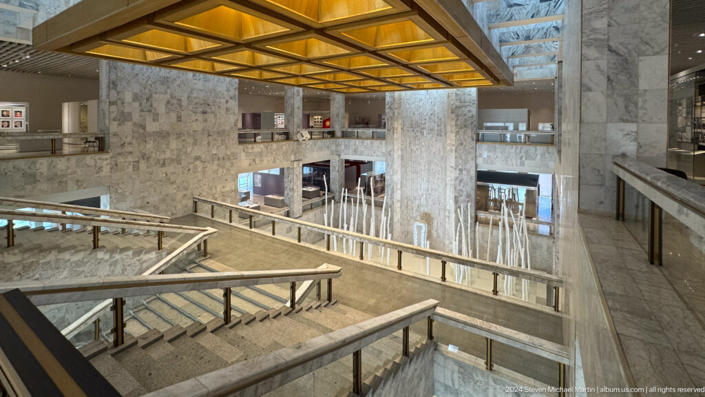 Another wide view across museum atrium and stairs.