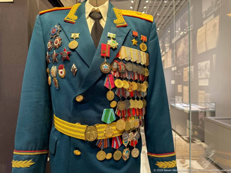 Dark green military uniform covered with medals.