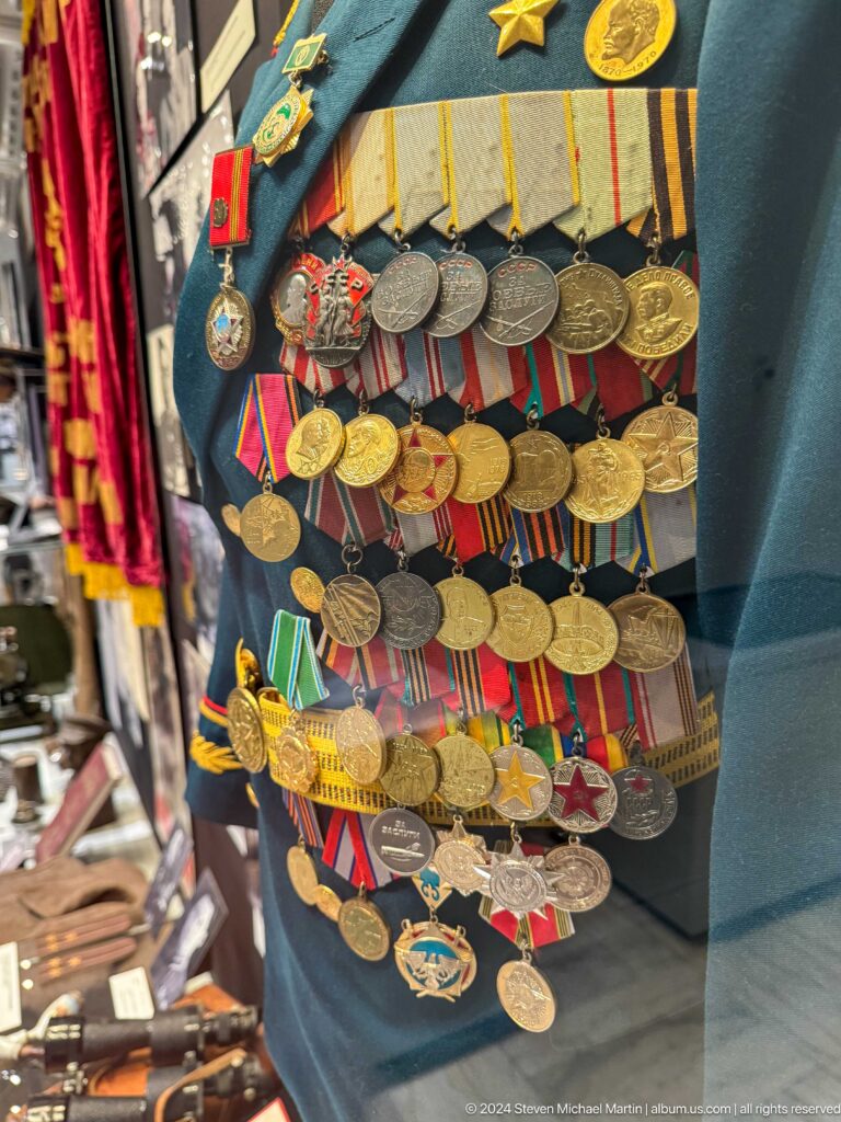 Close view of dense rows of Soviet medals.