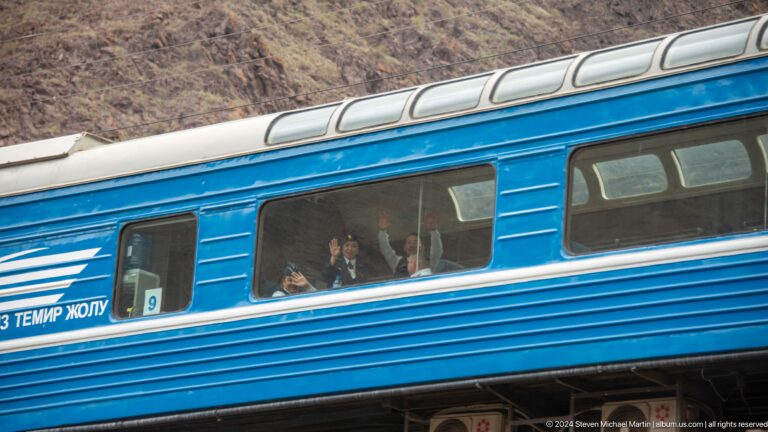 Close view of a blue passenger railcar.