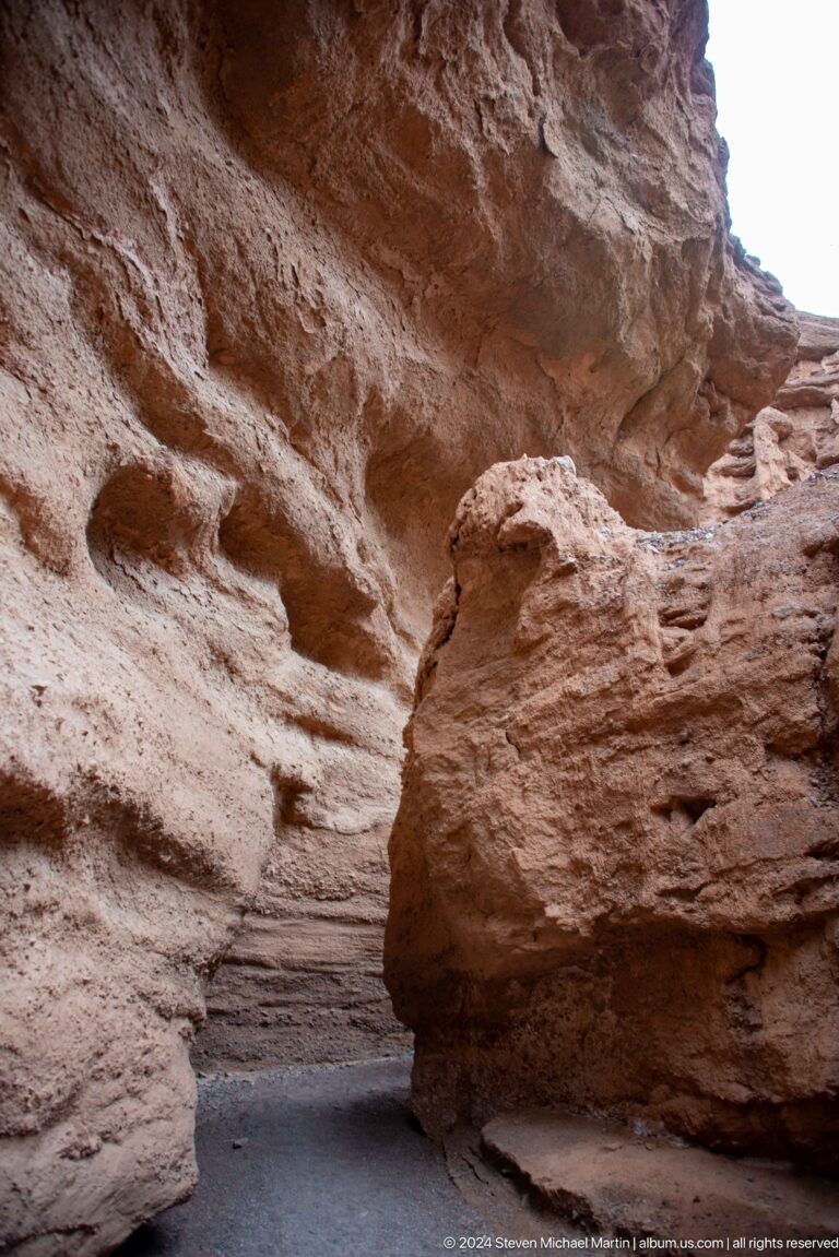 Rounded pedestal-like earthen formation in close view.