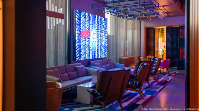 Lounge with leather chairs and blue illuminated wall in Muscat, Oman.