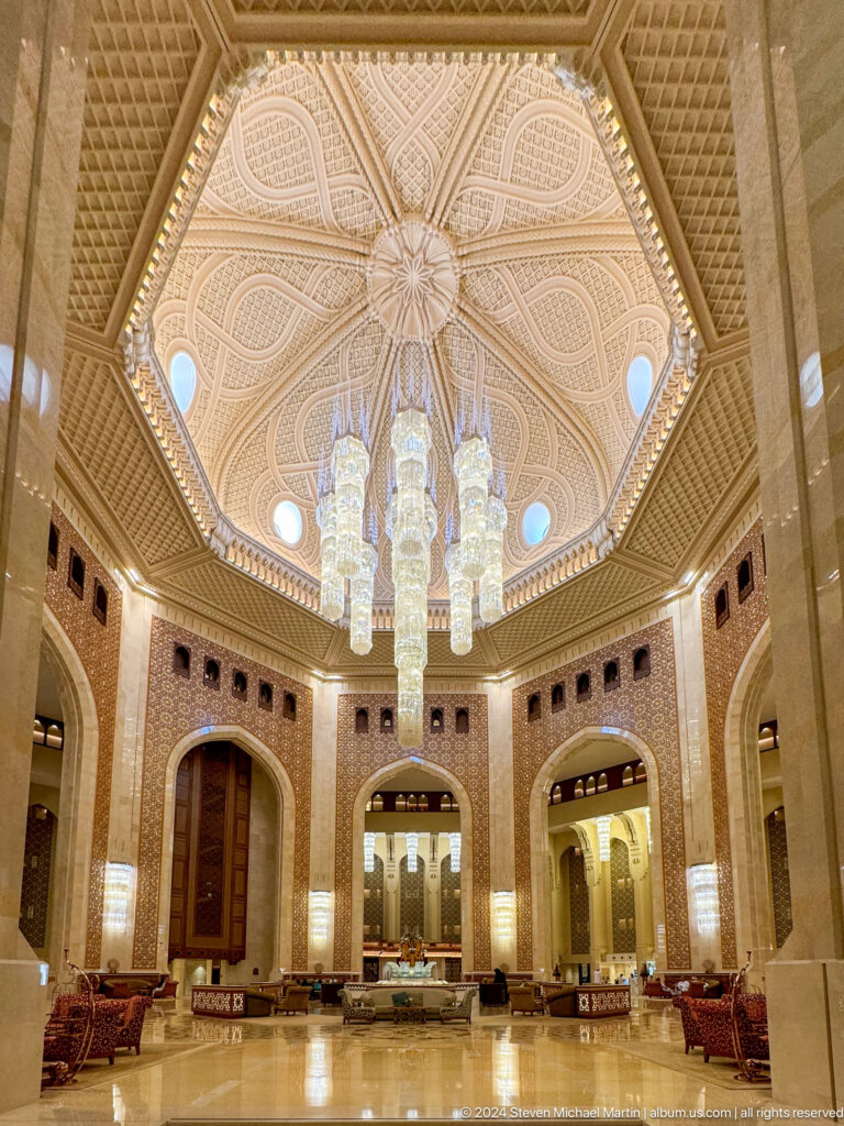 Wide view of octagonal hall and chandelier in Muscat, Oman.
