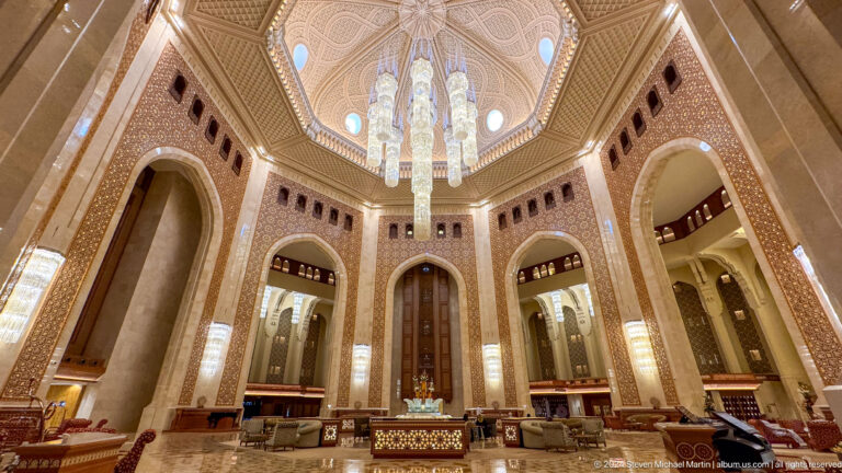 Grand hall viewed upward toward chandelier in Muscat, Oman.