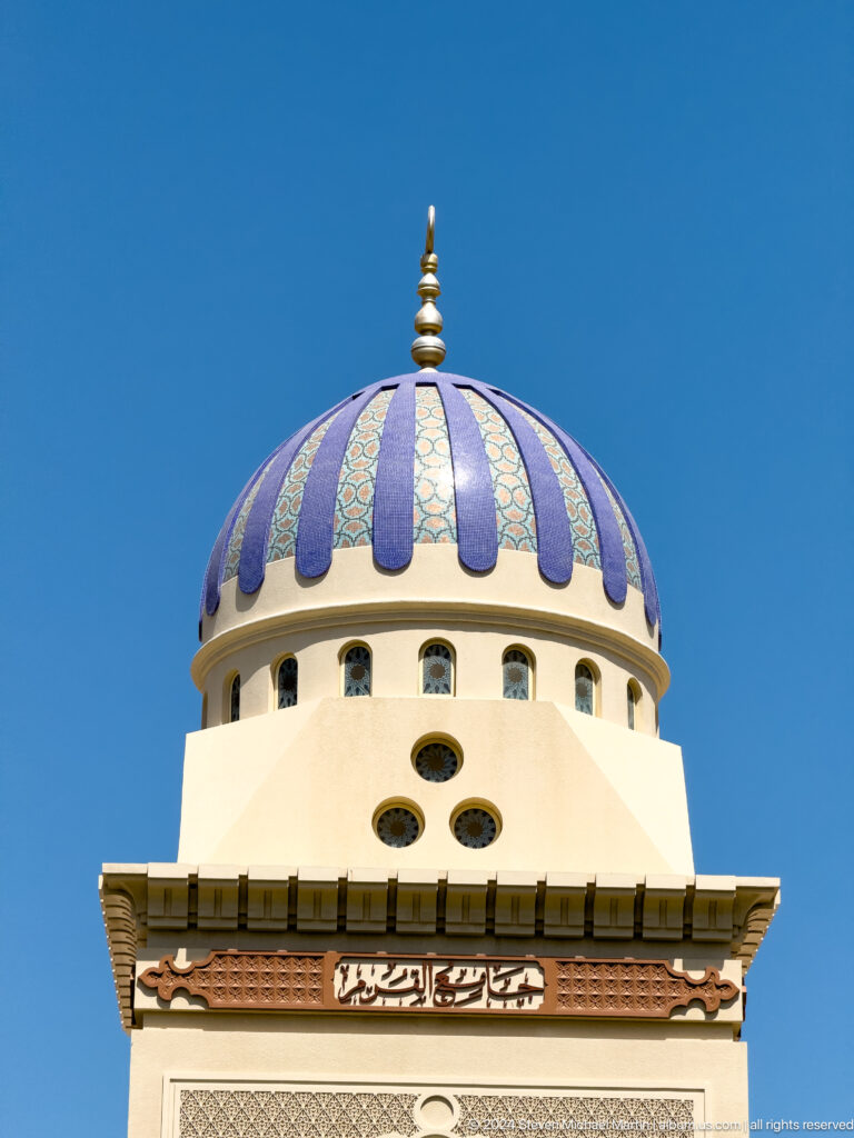 Blue-and-white striped mosque dome close-up in Muscat, Oman.
