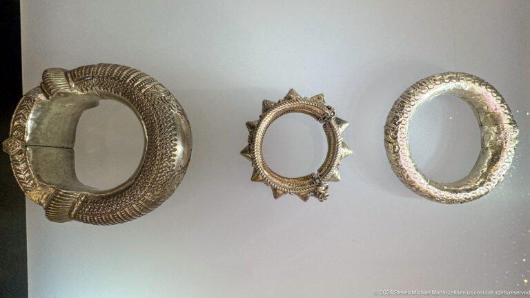 Group of circular silver bracelets and rings in Muscat, Oman.