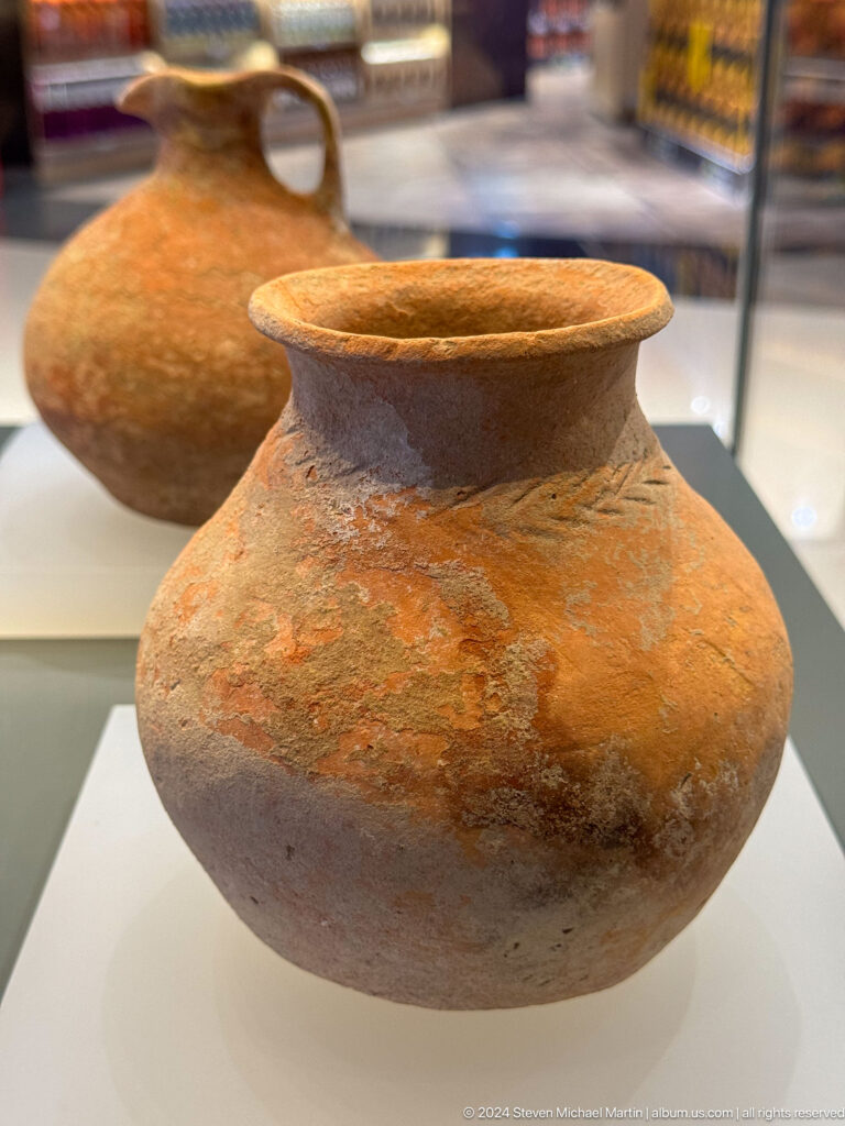 Orange-brown pottery jar with narrow mouth in Muscat, Oman.