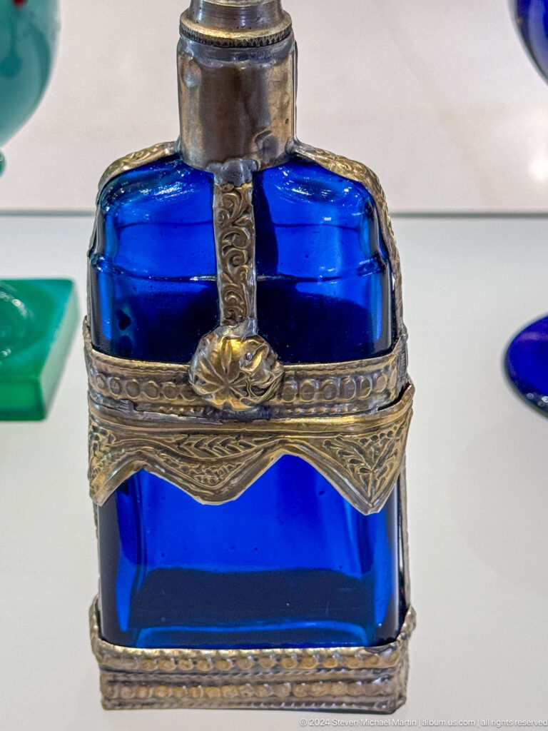 Close detail of cobalt glass vessel in ornate silver mount in Muscat, Oman.