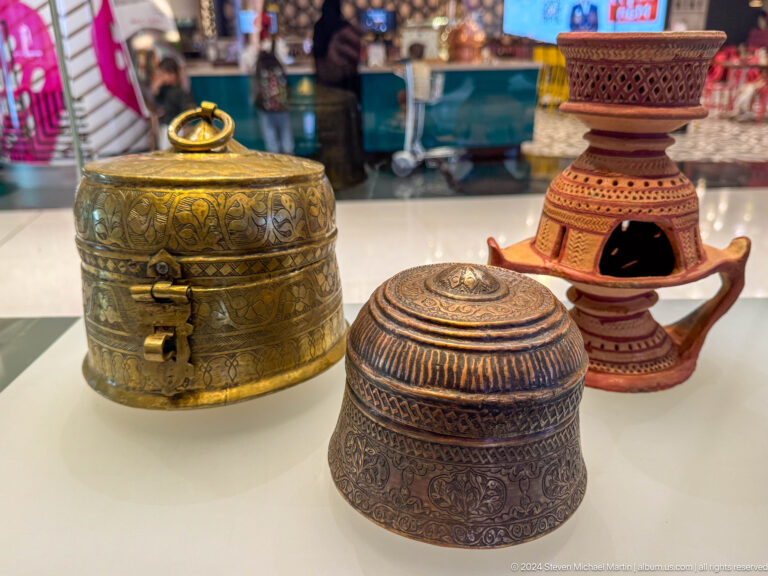 Group of traditional metal and pottery containers in Muscat, Oman.