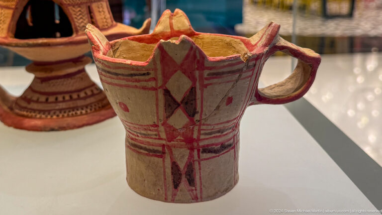 Painted reddish pottery pitcher with angular handle in Muscat, Oman.