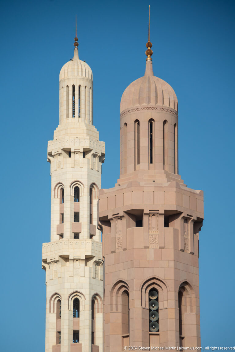 Two contrasting minarets overlapping in Muscat, Oman.