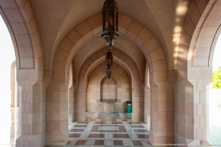 Long vaulted arcade with hanging lanterns in Muscat, Oman.