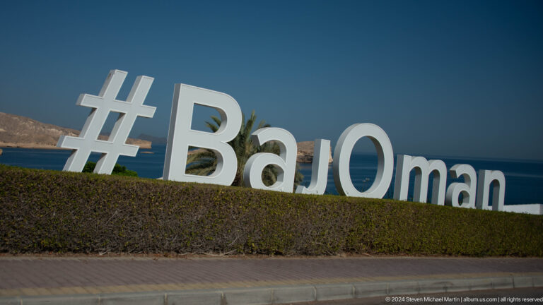 Large hashtag sign reading #BaOman in Muscat, Oman.