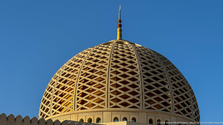 Close view of golden geometric dome in Muscat, Oman.