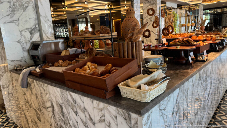 Hotel bakery counter with bread displays in Muscat, Oman.