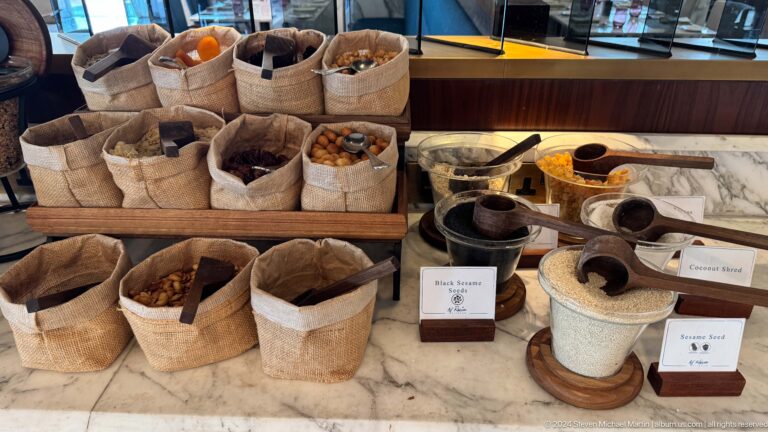 Woven baskets containing grains and bakery ingredients in Muscat, Oman.