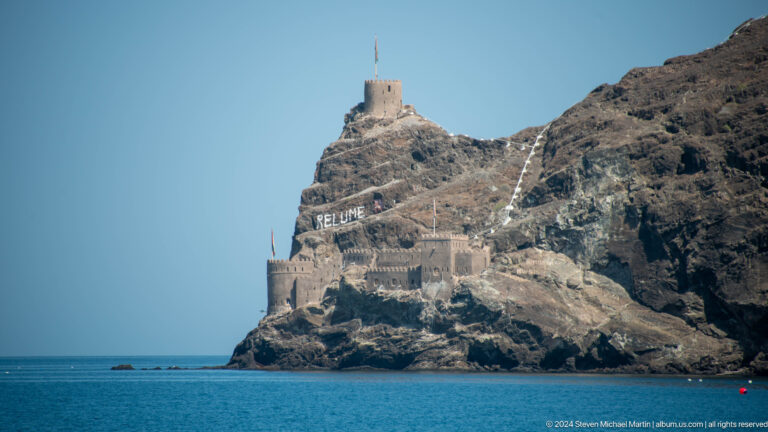 Steep rocky promontory crowned by fort.