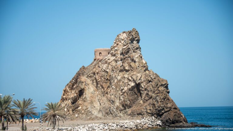 Small fort perched atop steep rocky outcrop.