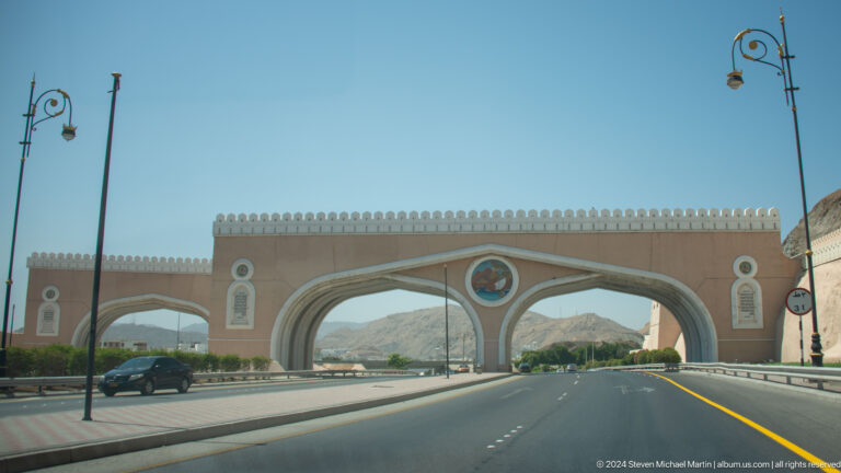 Decorative highway gateway spanning road.