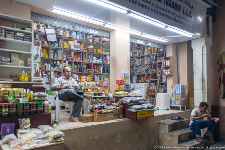Small shop packed with books and goods.