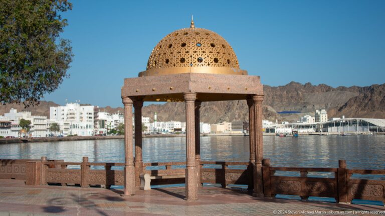 Ornate domed pavilion on waterfront.