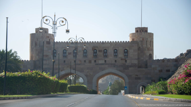 Monumental arched gateway with twin towers.