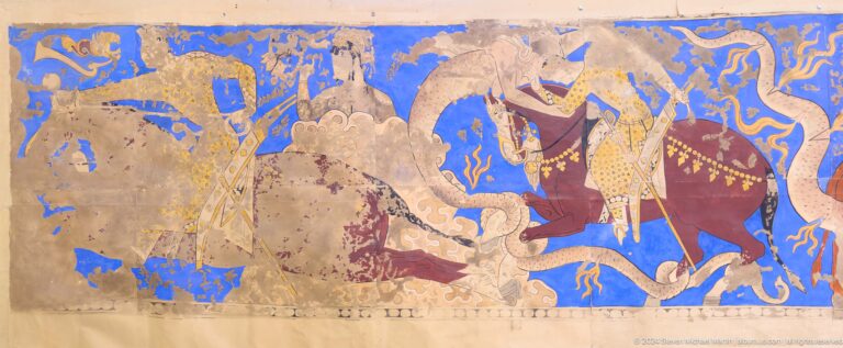 Fragmentary Sogdian wall painting from Ancient Panjakent showing a richly dressed figure beside a large pale curving form on a blue background with painted textile patterns.
