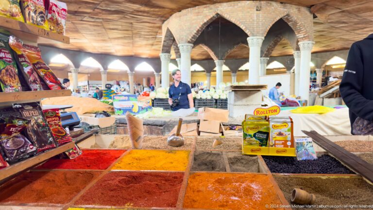 Spice counters beneath pointed arches in the covered market.