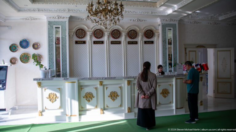 Brightly decorated reception counter in a public interior.