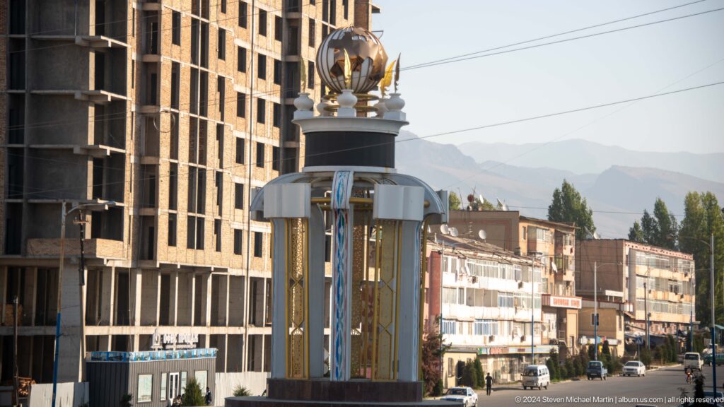 Ornamental city clock monument on a central avenue.